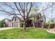 Inviting home with well-maintained lawn, two-car garage and mature trees at 5421 S Vivian St, Littleton, CO 80127