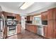 Updated kitchen features granite counters, stainless steel appliances, and modern subway tile backsplash at 5421 S Vivian St, Littleton, CO 80127