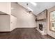 Living room featuring hardwood floors, brick fireplace and vaulted ceilings at 5421 S Vivian St, Littleton, CO 80127
