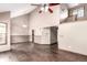 Open living area with hardwood floors, vaulted ceilings, and access to other rooms at 5421 S Vivian St, Littleton, CO 80127