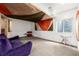 Finished basement with colorful decorations, bright windows, and new carpet at 17706 Cherokee St, Broomfield, CO 80023
