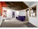 This finished basement features a creative design and leads to a half bath at 17706 Cherokee St, Broomfield, CO 80023