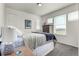 Bright bedroom featuring neutral walls, plush carpet, many windows, and comfortable furnishings at 17706 Cherokee St, Broomfield, CO 80023