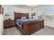 Comfortable main bedroom featuring a large wooden bed, plush bedding, and ample natural light at 17706 Cherokee St, Broomfield, CO 80023