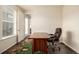 The office features a spacious layout with a desk and chair, plus a window letting in natural light at 17706 Cherokee St, Broomfield, CO 80023