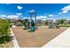 Community playground featuring multiple slides and play structures with picnic area at 17706 Cherokee St, Broomfield, CO 80023