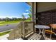 Cozy covered front porch featuring a charming table setting and a view of the street and park at 17706 Cherokee St, Broomfield, CO 80023