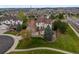 Aerial view of house with well maintained yard, mature trees, and cul-de-sac driveway at 22485 Laurel Oak Dr, Parker, CO 80138