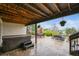Covered back patio with hot tub, outdoor seating, and hanging plants for relaxing outside at 22485 Laurel Oak Dr, Parker, CO 80138
