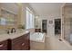 Bright bathroom features a soaking tub, a walk-in shower, dual vanities with framed mirrors at 22485 Laurel Oak Dr, Parker, CO 80138