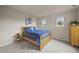 Bedroom featuring a bed with blue plaid bedding, neutral walls, and carpeted flooring at 22485 Laurel Oak Dr, Parker, CO 80138