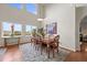 Dining room with hardwood floors, large windows with view and decorative light fixture at 22485 Laurel Oak Dr, Parker, CO 80138