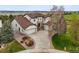 Stunning two-story home with a three-car garage, lovely landscaping and expansive driveway at 22485 Laurel Oak Dr, Parker, CO 80138