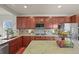 Open eat-in kitchen featuring stainless steel appliances, granite countertops and wood cabinets at 22485 Laurel Oak Dr, Parker, CO 80138