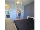 Modern bedroom with closet, ensuite bathroom, and unique light fixture at 4680 Copeland Loop # 203, Highlands Ranch, CO 80126