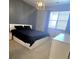 Bedroom with a modern design featuring a platform bed, and minimalist decor at 4680 Copeland Loop # 203, Highlands Ranch, CO 80126