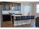 Modern kitchen features stainless steel appliances, granite countertops and a center island at 4680 Copeland Loop # 203, Highlands Ranch, CO 80126