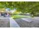 Expansive backyard with mature trees, a patio, and a well-maintained lawn at 5857 S Logan Ct, Centennial, CO 80121