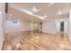 Finished basement featuring wood flooring, a support beam, and recessed lighting at 5857 S Logan Ct, Centennial, CO 80121
