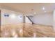 Finished basement space with hardwood flooring, recessed lighting, and access to stairs at 5857 S Logan Ct, Centennial, CO 80121