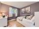 Comfortable bedroom with hardwood floors, neutral walls, and a decorative rug at 5857 S Logan Ct, Centennial, CO 80121