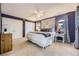 Spacious main bedroom with carpet floors, a ceiling fan, and decorative headboard at 5857 S Logan Ct, Centennial, CO 80121