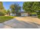 Spacious two-car garage and driveway, perfect for multiple vehicles and easy access at 5857 S Logan Ct, Centennial, CO 80121