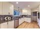 Modern kitchen with granite countertops, stainless steel appliances, and ample cabinet space at 5857 S Logan Ct, Centennial, CO 80121