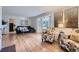 Bright living room featuring hardwood floors, bay window, and stylish decor at 5857 S Logan Ct, Centennial, CO 80121