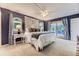 Large primary bedroom features plush carpeting and a sliding glass door to the backyard at 5857 S Logan Ct, Centennial, CO 80121
