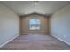 Spacious bedroom with vaulted ceiling, neutral carpet, and a window offering mountain views at 16858 Greyhawk Dr, Monument, CO 80132