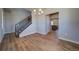 Dining area with hardwood floors, a chandelier, and a staircase leading to the upper level at 16858 Greyhawk Dr, Monument, CO 80132