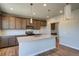 Modern kitchen featuring granite countertops, stainless steel appliances, and wooden cabinets at 16858 Greyhawk Dr, Monument, CO 80132