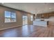 Open-concept living room features a kitchen, ample natural light and mountain views at 16858 Greyhawk Dr, Monument, CO 80132