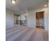 Loft area with plush carpet and view of the laundry room, stairs, and an open floorplan at 16858 Greyhawk Dr, Monument, CO 80132