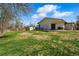 Spacious backyard with a lawn, patio, seating, and storage shed at 13905 W 21St Ave, Golden, CO 80401
