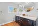 Bathroom boasts a spacious double vanity with modern fixtures, natural light, and clean design at 13905 W 21St Ave, Golden, CO 80401