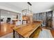 Bright dining room showcasing a rustic wood table, decorative lighting, and stylish wood wall paneling at 13905 W 21St Ave, Golden, CO 80401