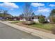Charming single-story home with a well-manicured lawn and colorful landscaping at 13905 W 21St Ave, Golden, CO 80401