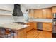 Modern kitchen boasting stainless steel appliances, a granite countertop, and custom cabinetry at 13905 W 21St Ave, Golden, CO 80401