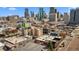 High aerial view of a bustling cityscape with a clear sky and visible buildings at 2318 Arapahoe St, Denver, CO 80205