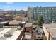 Rooftop view showcasing a brick building next to a modern building and city in the distance at 2318 Arapahoe St, Denver, CO 80205