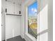 Closet interior showing window with outside view and metal closet bar at 2318 Arapahoe St, Denver, CO 80205