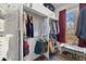A well-organized walk-in closet features ample storage space and natural light at 2318 Arapahoe St, Denver, CO 80205