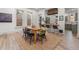 Bright dining room with large windows and stylish furniture, connecting to the kitchen at 2318 Arapahoe St, Denver, CO 80205