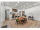 Well-lit dining room with modern decor, adjacent to the kitchen and breakfast bar at 2318 Arapahoe St, Denver, CO 80205