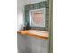 Charming nook in the kitchen with wood counter and custom tiled mirror at 2318 Arapahoe St, Denver, CO 80205