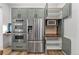 Kitchen boasts stainless steel appliances, built-in microwave, and ample cabinet space at 2318 Arapahoe St, Denver, CO 80205