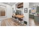 Modern kitchen with breakfast bar, butcher block counter, and stylish cabinetry at 2318 Arapahoe St, Denver, CO 80205