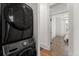 A convenient laundry area features a modern stacked washer and dryer at 2318 Arapahoe St, Denver, CO 80205